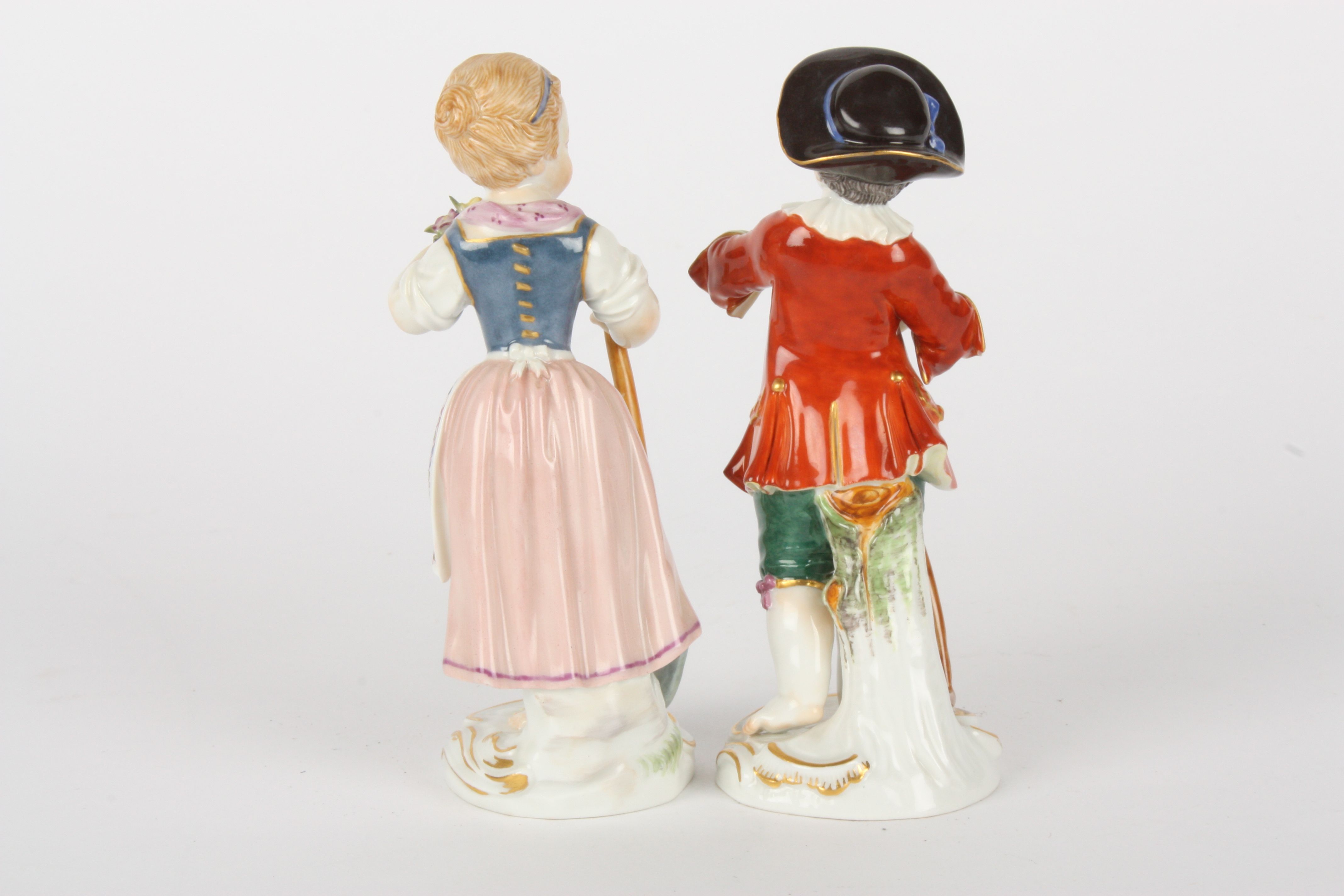 Pair of Late 20th century Meissen figures modelled as a gardening boy holding a rake and girl - Image 2 of 5