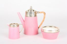 A Royal Worcester pink glazed and silver mounted 'tea for one' setcomprising teapot, milk jug and