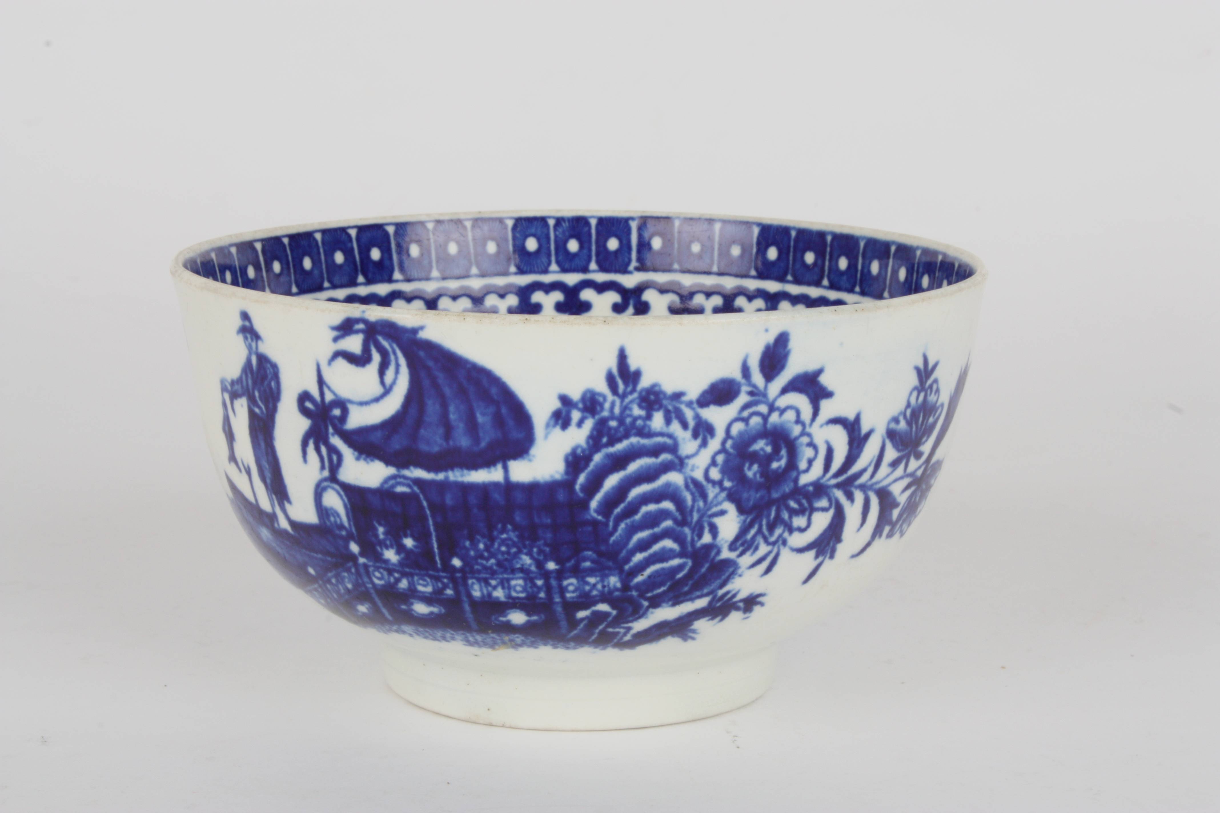 A late 18th century Worcester transfer printed blue and white bowl
decorated in the Fisherman and