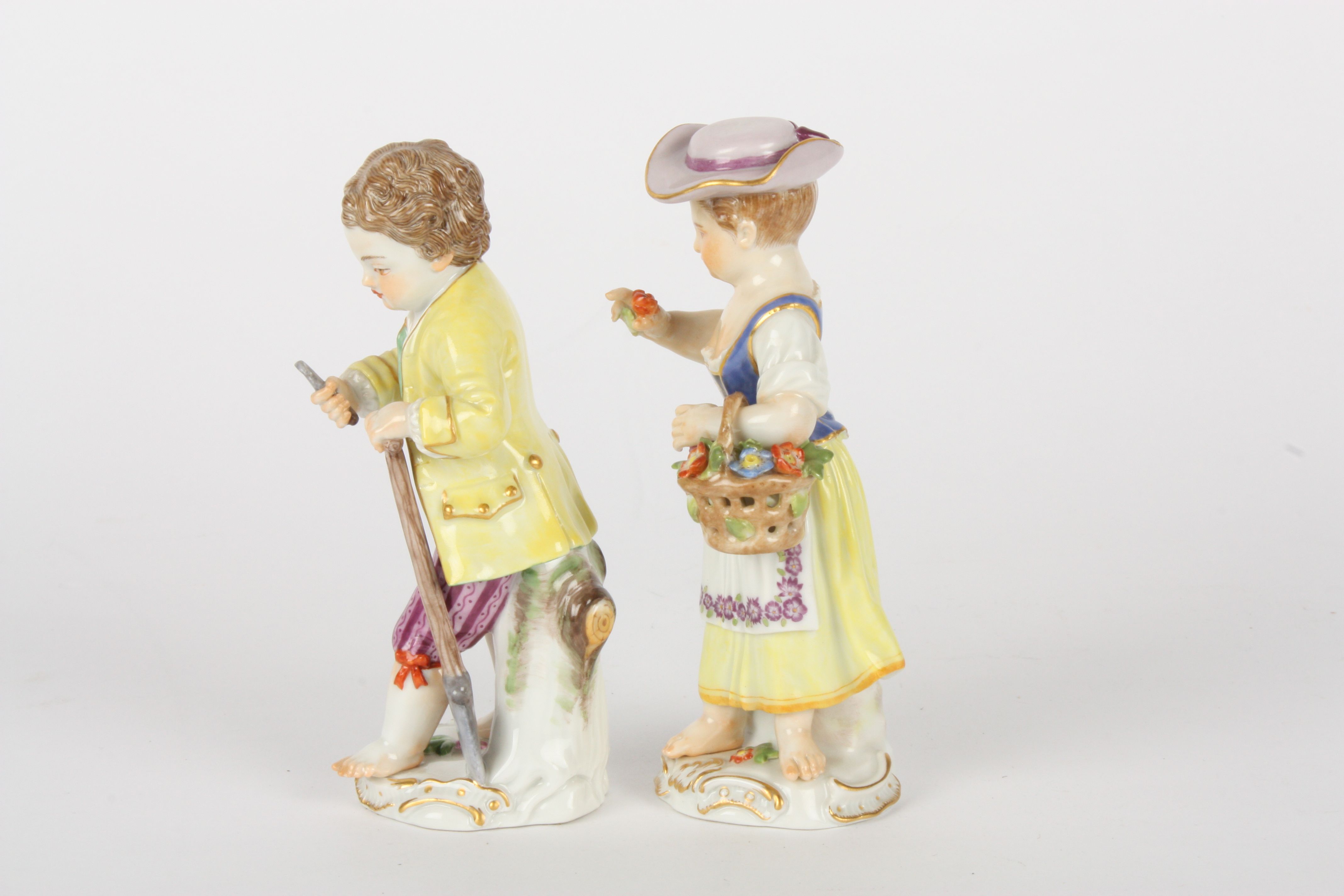 Pair of late 20th century Meissen gardener boy and girl figures, each modelled standing, boy holding - Image 3 of 5