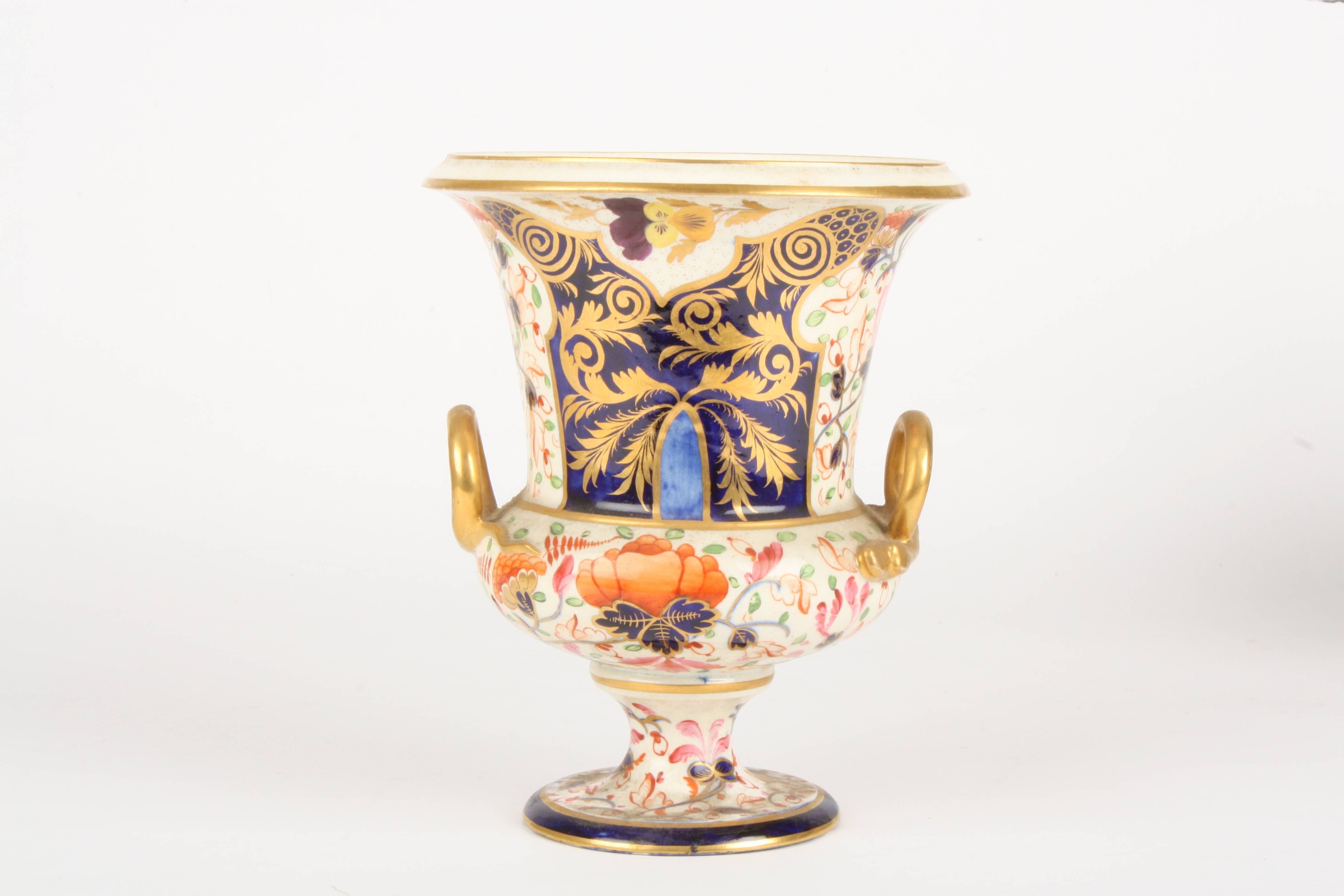 An early 19th century Derby Imari campagna urn
decorated with orange flowers, leaves and scrolls - Image 2 of 3