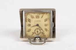 An early 20th century Eszera Continental silver folding travelling watchthe square dial with Arabic