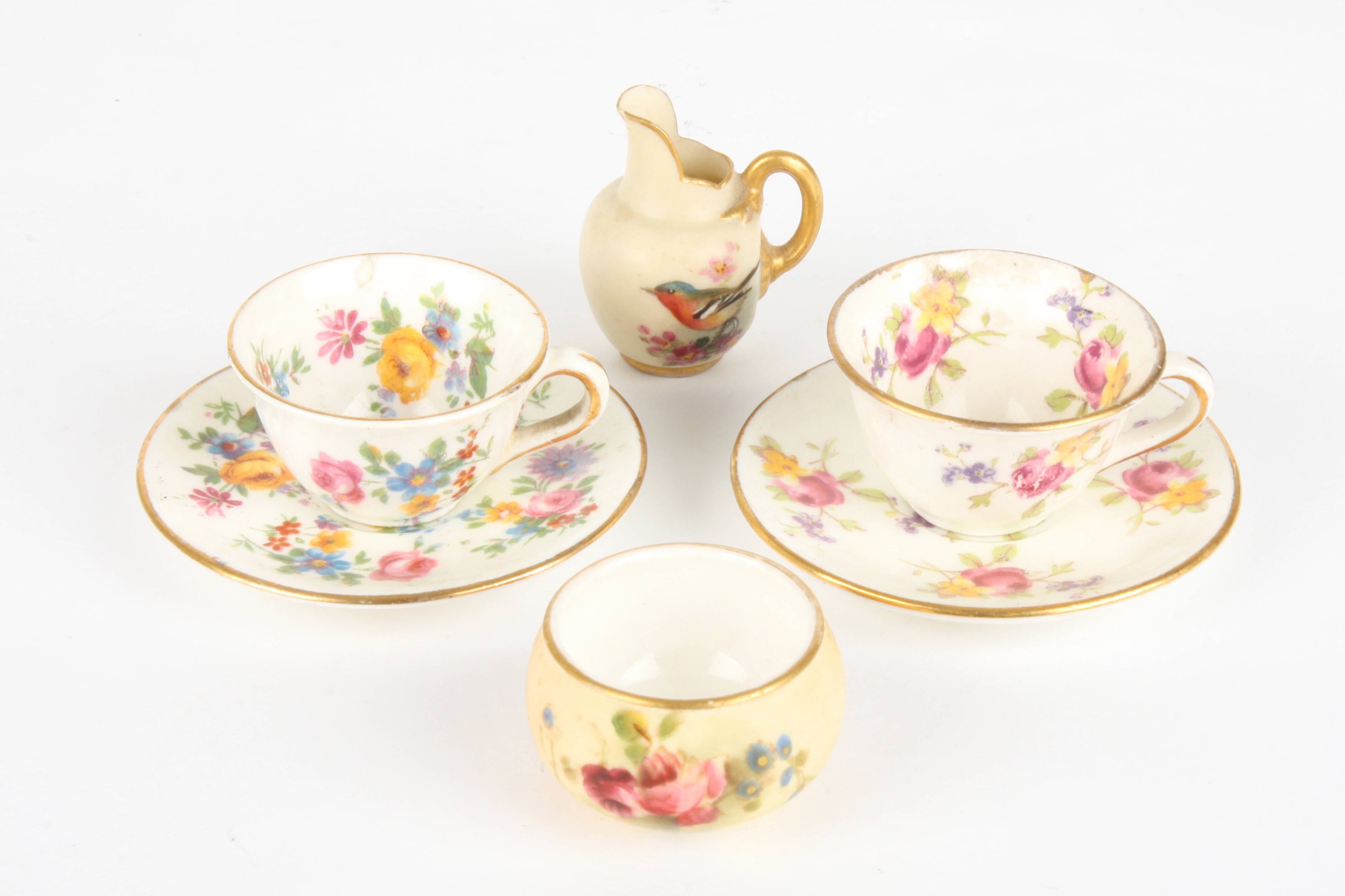 A miniature Royal Worcester blush ivory jug and bowl
the bowl painted flowers, the jug painted