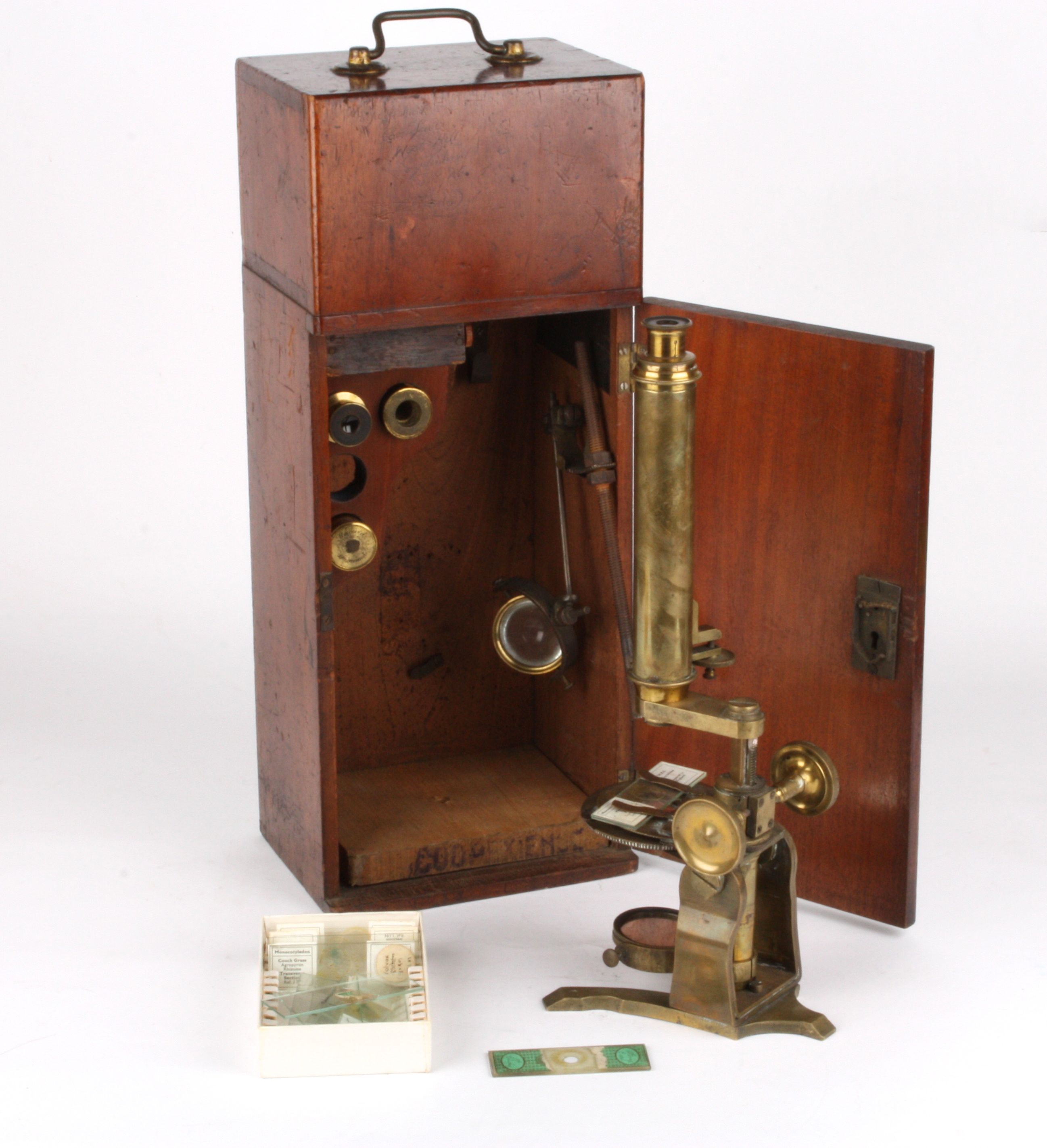 A late 19th century brass monocular microscope
the trunnions supported on a Y shaped base, with rack