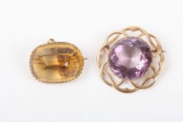 A 9ct gold and amethyst coloured stone broochtogether with a yellow metal and citrine brooch. (