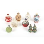 A collection of 8 Chinese snuff bottles
including two carved cameo glass bottles, two reverse