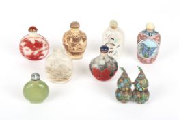 A collection of 8 Chinese snuff bottlesincluding two carved cameo glass bottles, two reverse