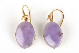 A fine pair of early 20th century Lilac Jade earringsthe oval jade plaques of good vibrant
