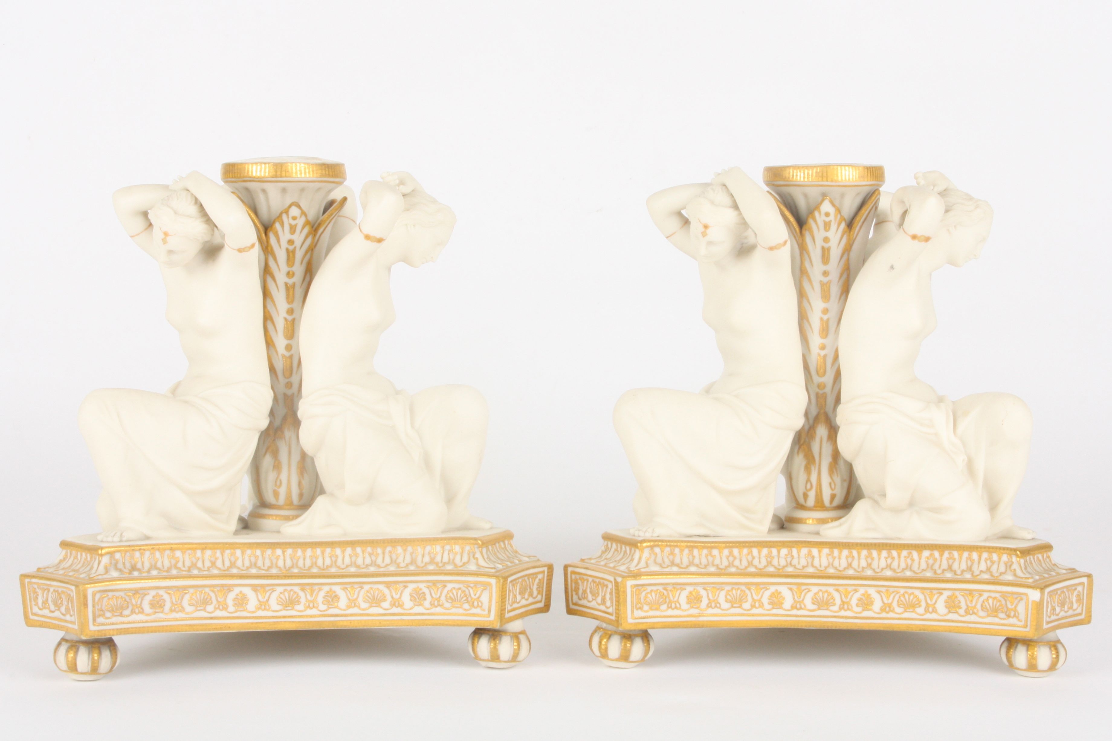 A pair of Victorian Copeland parian three graces candlesticks
formed as three kneeling semi-nudes - Image 2 of 2