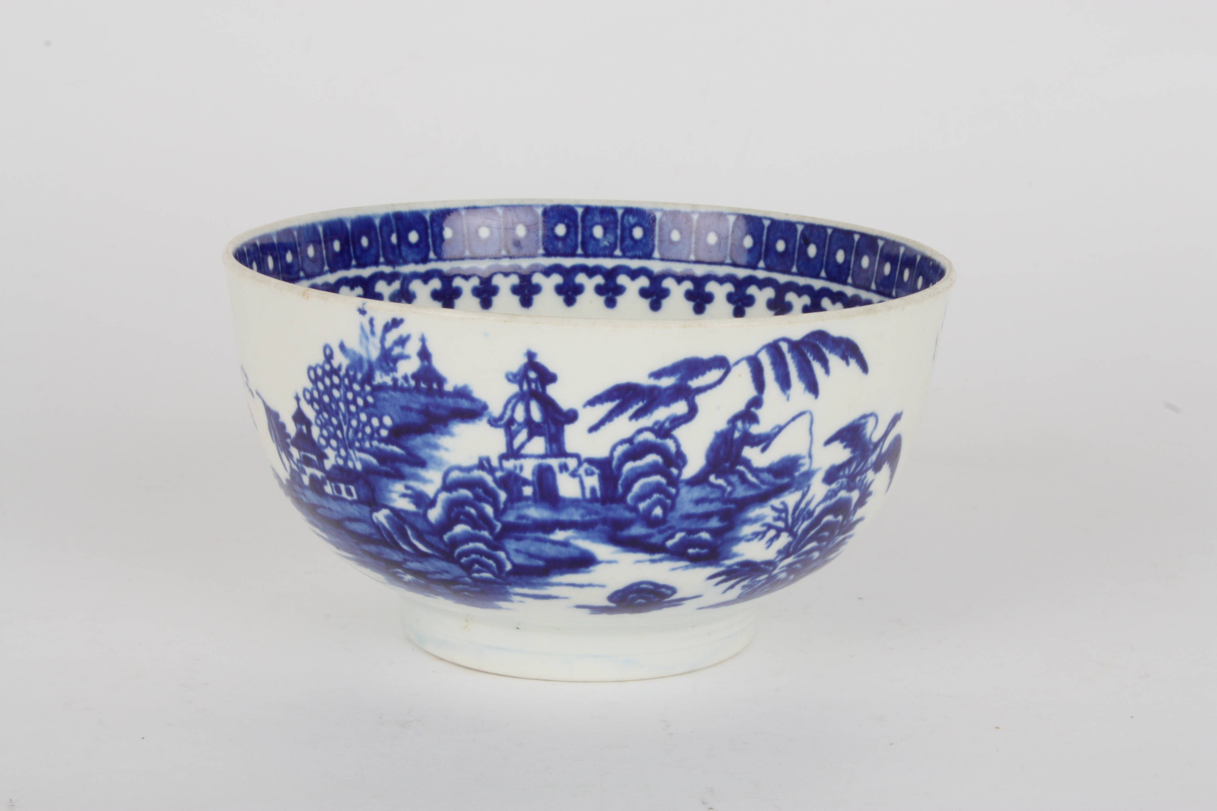 A late 18th century Worcester transfer printed blue and white bowl
decorated in the Fisherman and - Image 2 of 4