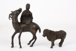 A 19th century Chinese bronze animal incense burnerformed as a sage riding a deer, together with
