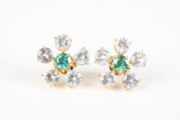 A pair of white sapphire and emerald flower head earringseach set with a central emerald weighing
