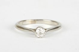 An 18ct white gold and diamond solitaire ringthe stone weighing approx. 0.15cts, in a plain white