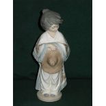 NAO GLAZED CERAMIC FIGURE- GIRL WITH SOM