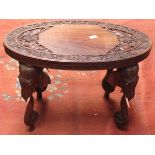 HEAVILY CARVED OVAL ELEPHANT TABLE