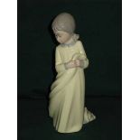 NAO GLAZED CERAMIC FIGURE- GIRL IN YELLO