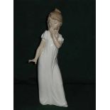 NAO GLAZED CERAMIC FIGURE OF A GIRL, APP