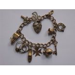 9ct GOLD LADIES CHARM BRACELET WITH TWELVE CHARMS AND HEART FORM CLASP, APPROXIMATELY 19.