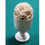 HEAVILY CARVED IVORY PUZZLE BALL ON STAND,