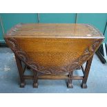 CARVED OAK GATELEG DINING TABLE