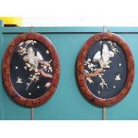 PAIR OF ORIENTAL LACQUERED, HANDPAINTED AND RELIEF DECORATED OVAL PANELS,