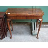 ANTIQUE MAHOGANY FOLD OVER CARD TABLE ON CABRIOLE SUPPORT