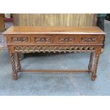 HEAVILY CARVED OAK FOUR DRAWER CONSOLE TABLE