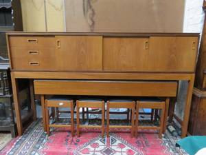 TIMES FURNISHING TEAK LONG JOHN SIDEBOARD ON RAISED SUPPORTS WITH LONG NARROW DROP LEAF TABLE AND