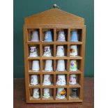 PARCEL OF TWENTY THIMBLES ON STAND INCLUDING WEDGWOOD, ROYAL WORCESTER, ETC.