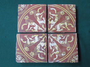 SET OF FOUR 17th/18th CENTURY DECORATIVE TILES,