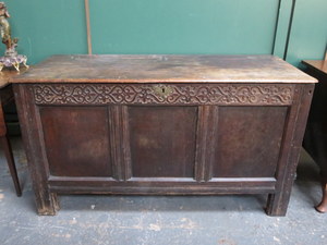 ANTIQUE OAK PANELLED AND CARVED COFFER