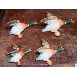 SET OF FOUR BESWICK GRADUATED MALLARD WALL PLAQUES (ONE AT FAULT)