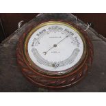 CARVED OAK CASED ANEROID BAROMETER BY CHADBURN & SON,
