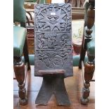 HEAVILY CARVED AFRICAN CHIEF'S CHAIR