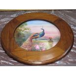 FRAMED HANDPAINTED CIRCULAR PORCELAIN PANEL DEPICTING A PEACOCK, SIGNED W BIRBECK,