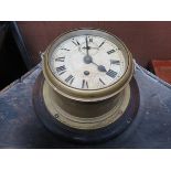 WALL MOUNTING BRASS SHIP'S CLOCK WITH ENAMELLED DIAL (AT FAULT)