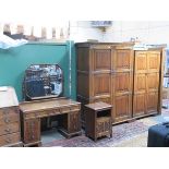 OAK LINENFOLD FRONTED BEDROOM SUITE COMPRISING TWO WARDROBES,