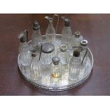 PLATED CIRCULAR TRAY AND VARIOUS SILVER TOPPED GLASS JARS