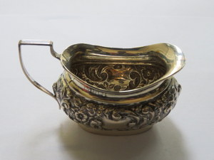 HALLMARKED SILVER REPOUSSE DECORATED SMALL MILK JUG,