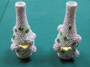 PAIR OF DRESDEN/MEISSEN CERAMIC VASES, RELIEF DECORATED WITH FLOWERS, LEAVES AND BIRDS (AT FAULT),