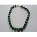 STRAND OF GRADUATED MALACHITE BEADS ON GOLD COLOURED CLASP