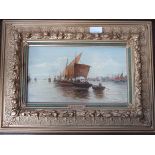 GILT FRAMED OIL ON PANEL DEPICTING SAILING SHIPS AT SEA, SIGNED H.