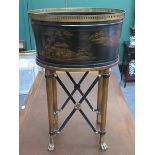 JAPANNED OVAL WINE COOLER ON RAISED CLAW SUPPORTS WITH GILDED ORIENTAL STYLE DECORATION