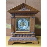 CARVED OAK CASED BRACKET CLOCK WITH BRASS DIAL