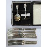 CASED SILVER PUSH AND SPOON SET AND SIX SILVER HANDLED KNIVES