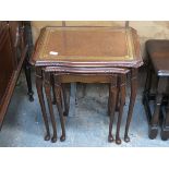 MAHOGANY GLASS TOPPED NEST OF THREE TABLES