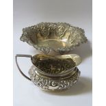 HALLMARKED SILVER REPOUSSE DECORATED SHALLOW DISH AND SMALL MILK JUG,