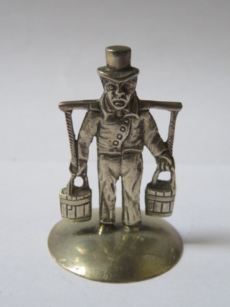 PRETTY MINIATURE '800' GERMAN SILVER FIGURE OF A WATER CARRIER,