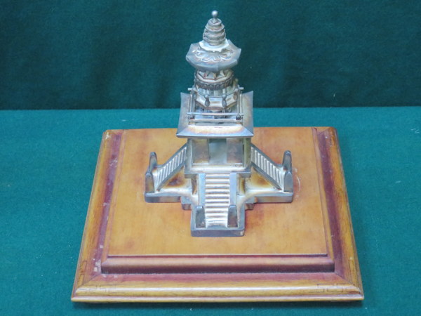UNHALLMARKED SILVER COLOURED MODEL PAGODA ON WOODEN STAND,