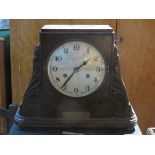 CARVED OAK CASED MANTLE CLOCK